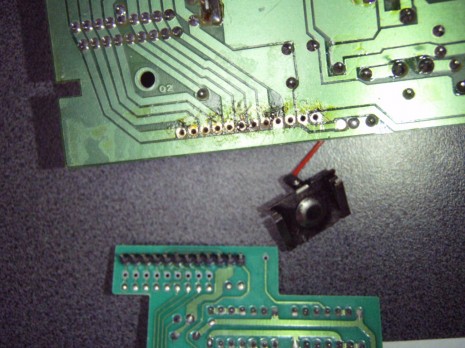 Remove excess solder from the pin holes